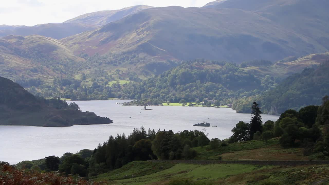 Ullswater seen from a hillside in backlit Autumn light. The Lake District National Park. Cumbria. Northern England. UK