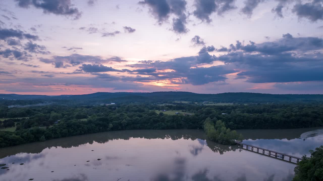 Slow Drifting Clouds Sunset Sky Reflects on Tranquil Waters at Lake Sequoyah In AR, USA - Hyperlapse Aerial
