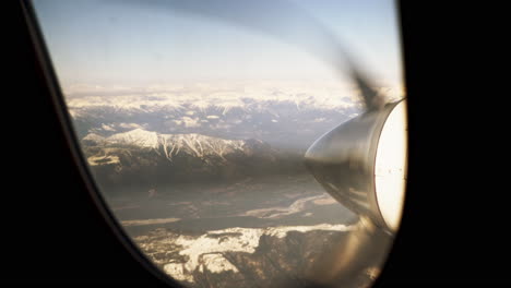 view from the window seat of a plane or propellers spinning through the sky