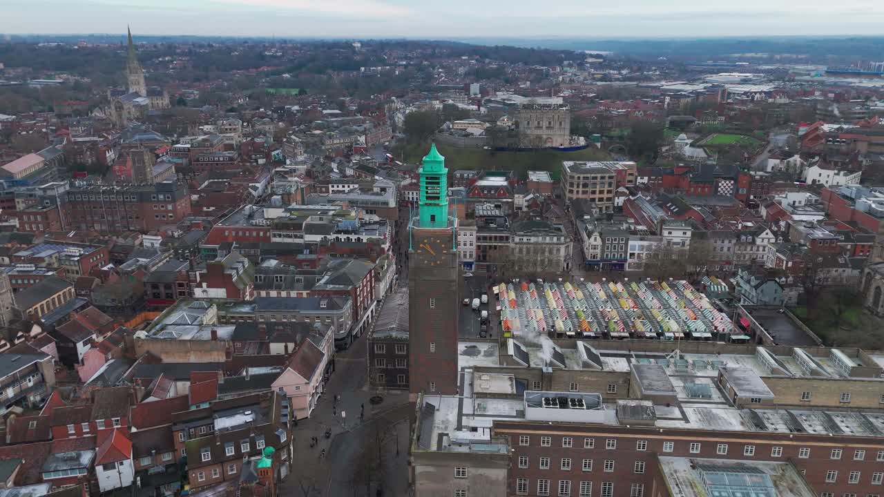 Turn the view to the Norwich market stalls and the clock tower