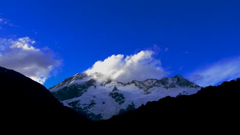 Snow-Capped-Mountain-Peaks-And-Moving-Clouds-Over-The-Southern-Alps-Of-New-Zealand