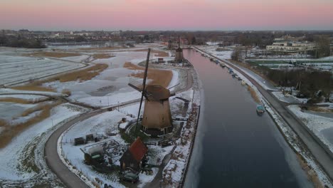 Beautiful-morning-at-winter-countryside-with-traditional-Dutch-windmill