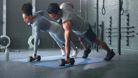 Fitness,-gym-and-couple-plank-with-weight-dumbbell