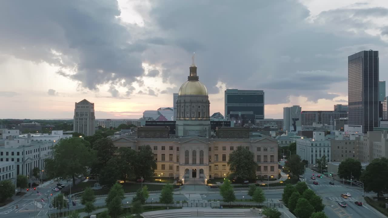 Slow aerial push in footage of the Capitol building during sunset in downtown Atlanta, Georgia