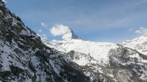 Wide-shot-of-Matterhorn-mountain-peak-covered-with-snow-on-a-sunny-day