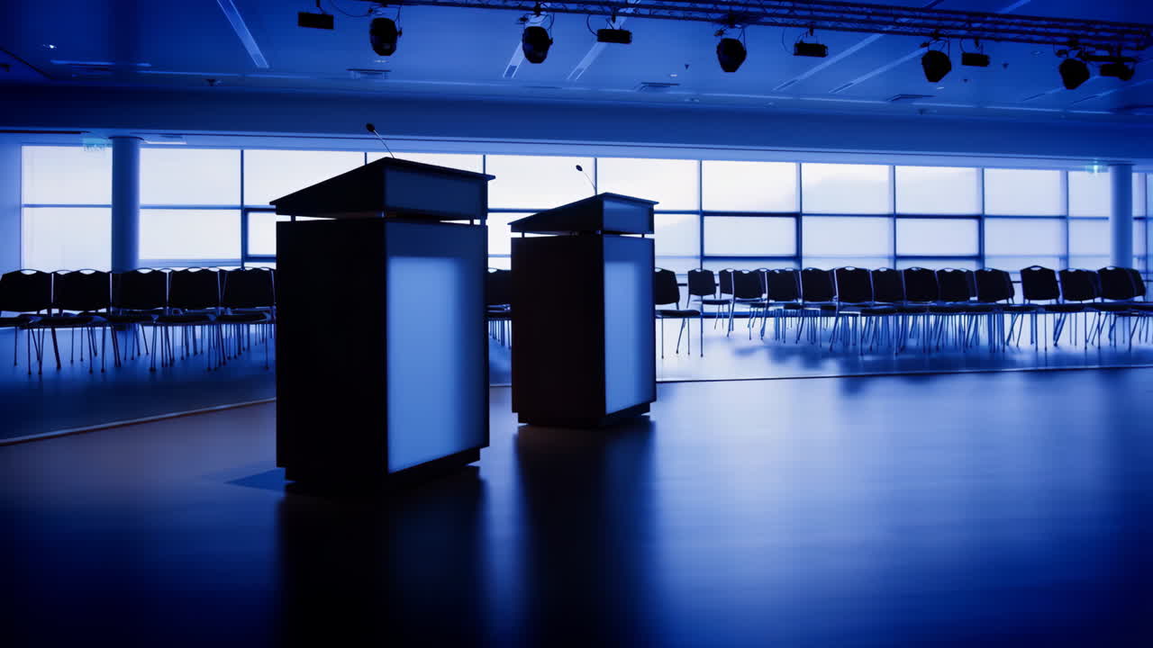Empty Conference Room with Two Podiums and Blue Lighting