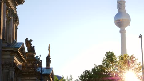 the berlin fernsehturm glowing at sunrise