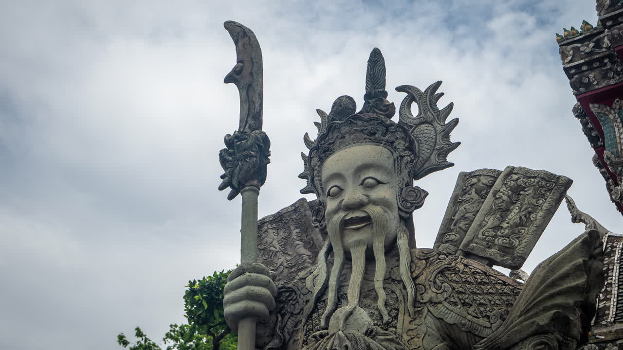 Time Lapse of Clouds Above Guard Keeper Sculpture in Wat Pho Temple, Bangkok, Thailand