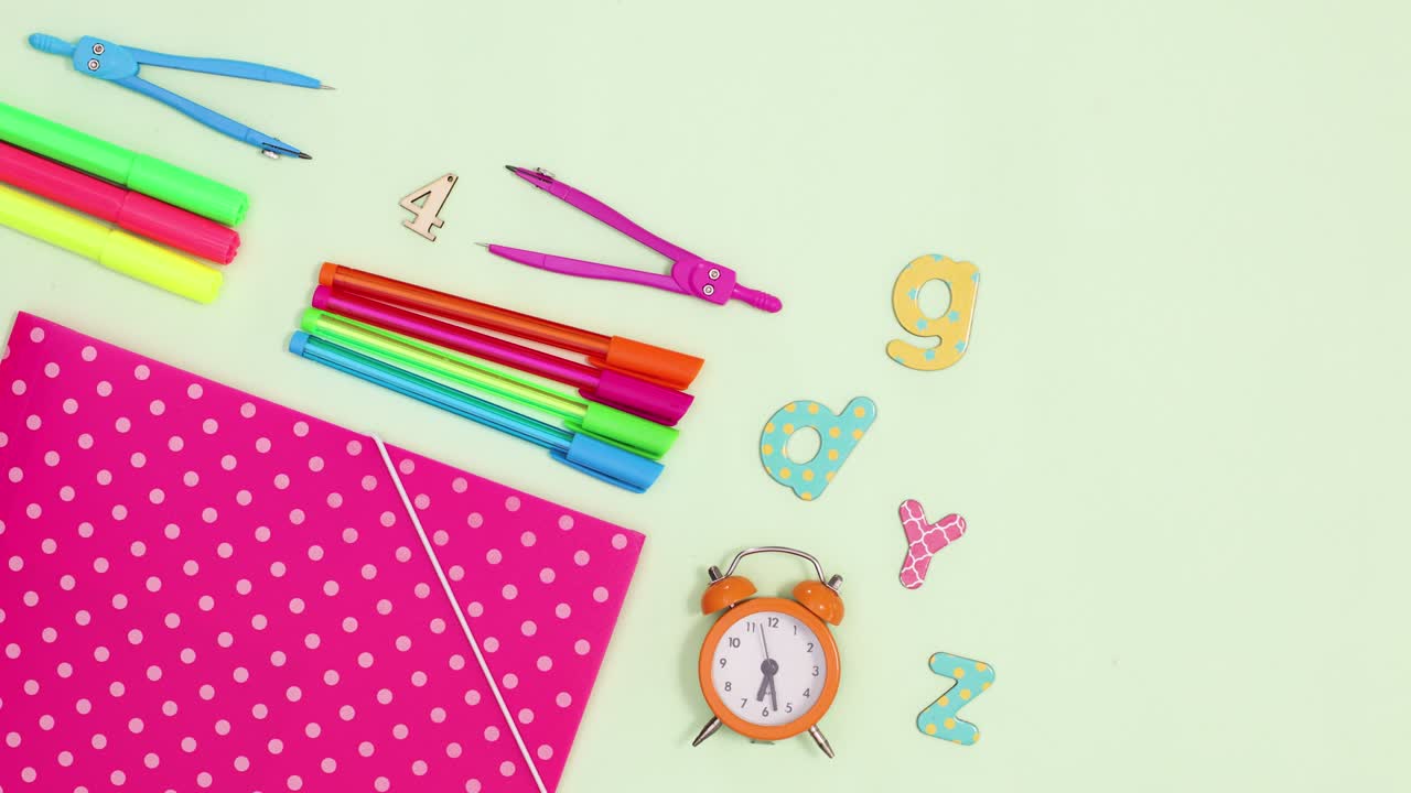 Time for school stop motion. School stationery appear on green theme. Stop motion