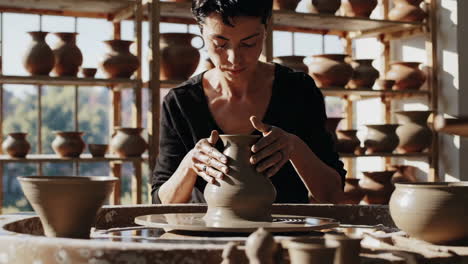 woman pottery artist at work