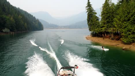 man wakeboarding with motorboat in the river 4k