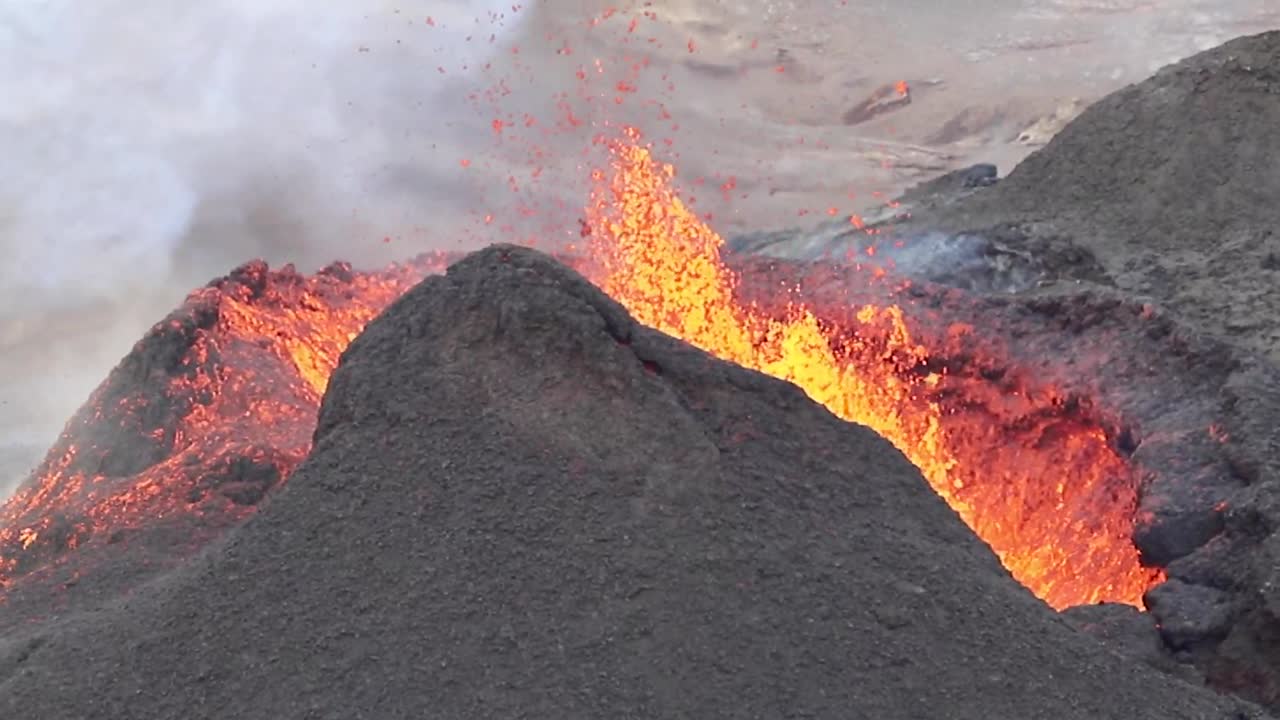 Iceland Volcanic Eruption 2021 with magma and lava exploding out of volcano cone