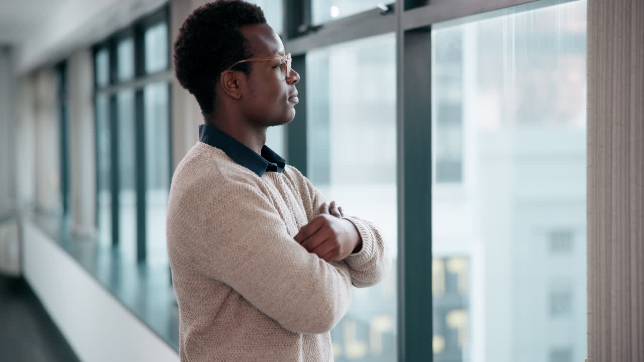 Man Looking Out Window in Office