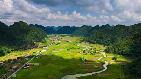 panoramic view of rural vietnamese valley with rice fields and river