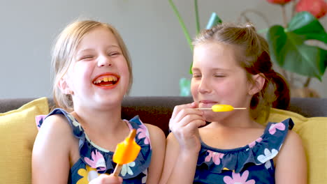 animated fraternal twins sit on couch eating refreshing ice lollies ice cream