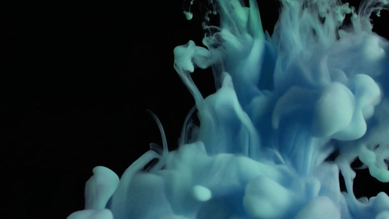 Blue Ink Dropping and Dissolving in Water