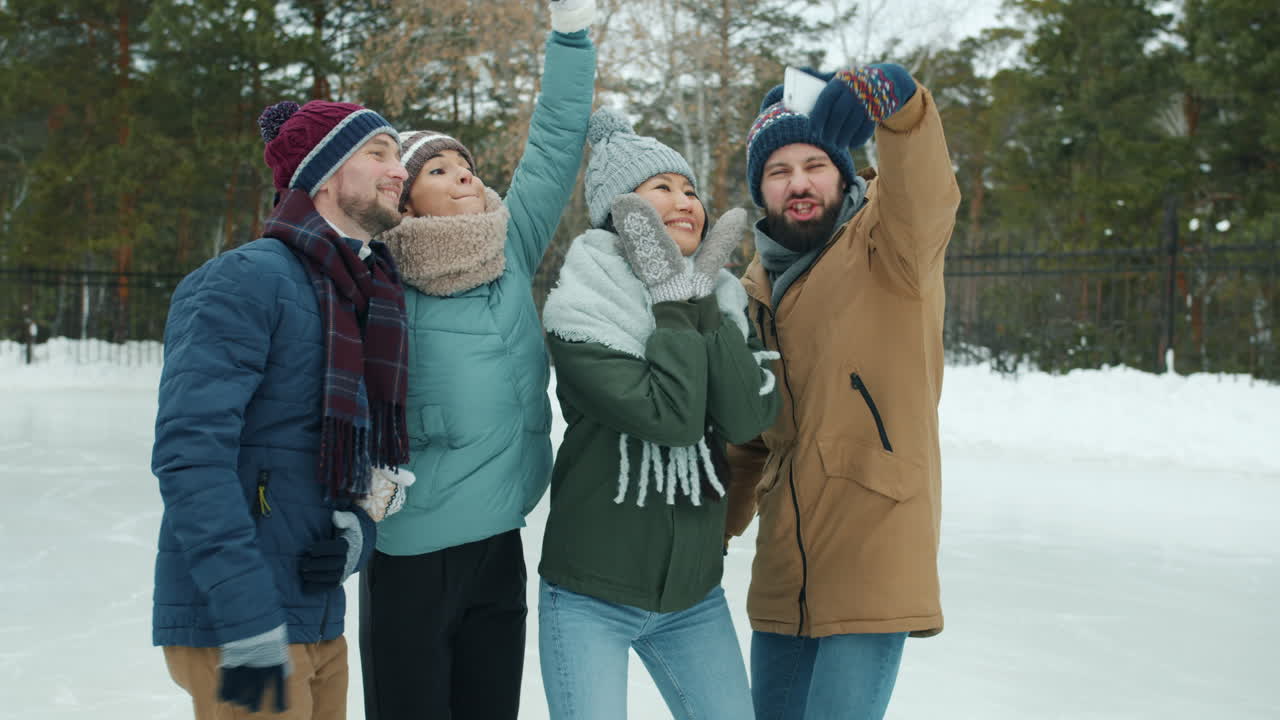 Friends Taking a Selfie at an Ice Rink in Winter