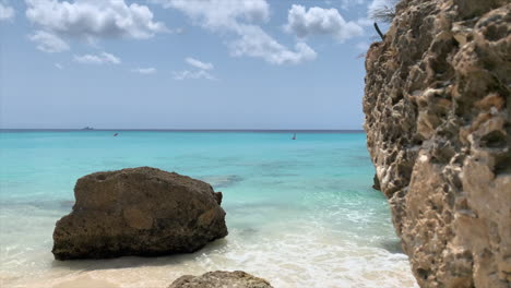 Slow-motion-reveal-of-waves-crashing-on-the-shores-of-a-rocky-beach