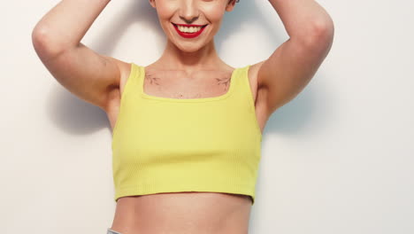 woman in a yellow ribbed crop top