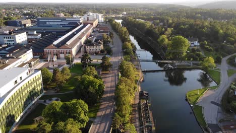 aerial of göta älv river next to industrial district in trollhättan at dawn