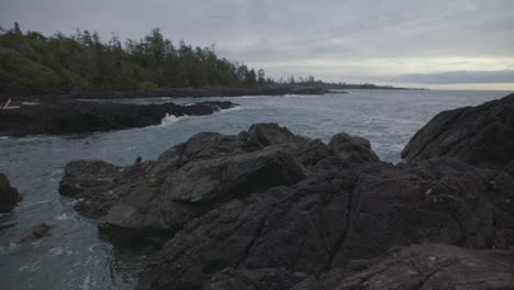 overcast twilight on a rocky shore in ucluelet, vancouver island, canada