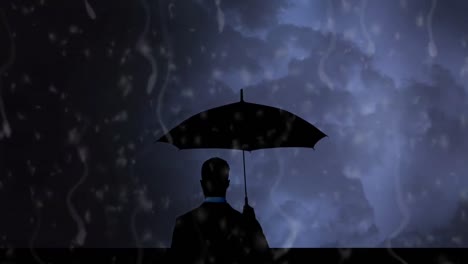 silhouette of a man watching a stormy sky