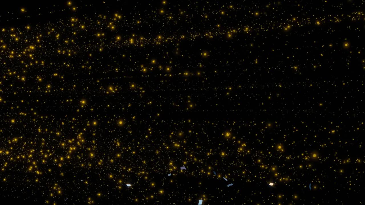 Top release sending metallic flakes descending, rotating, flashing over gold specks, forming spark