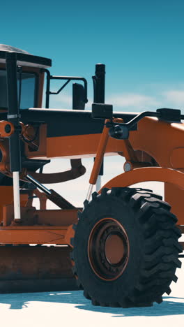 close up of an orange grader