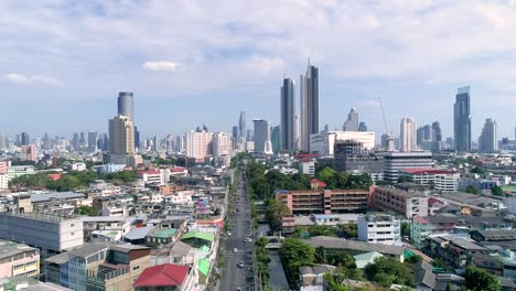 4k fly out of bangkok skyline, long road to a big city in asia