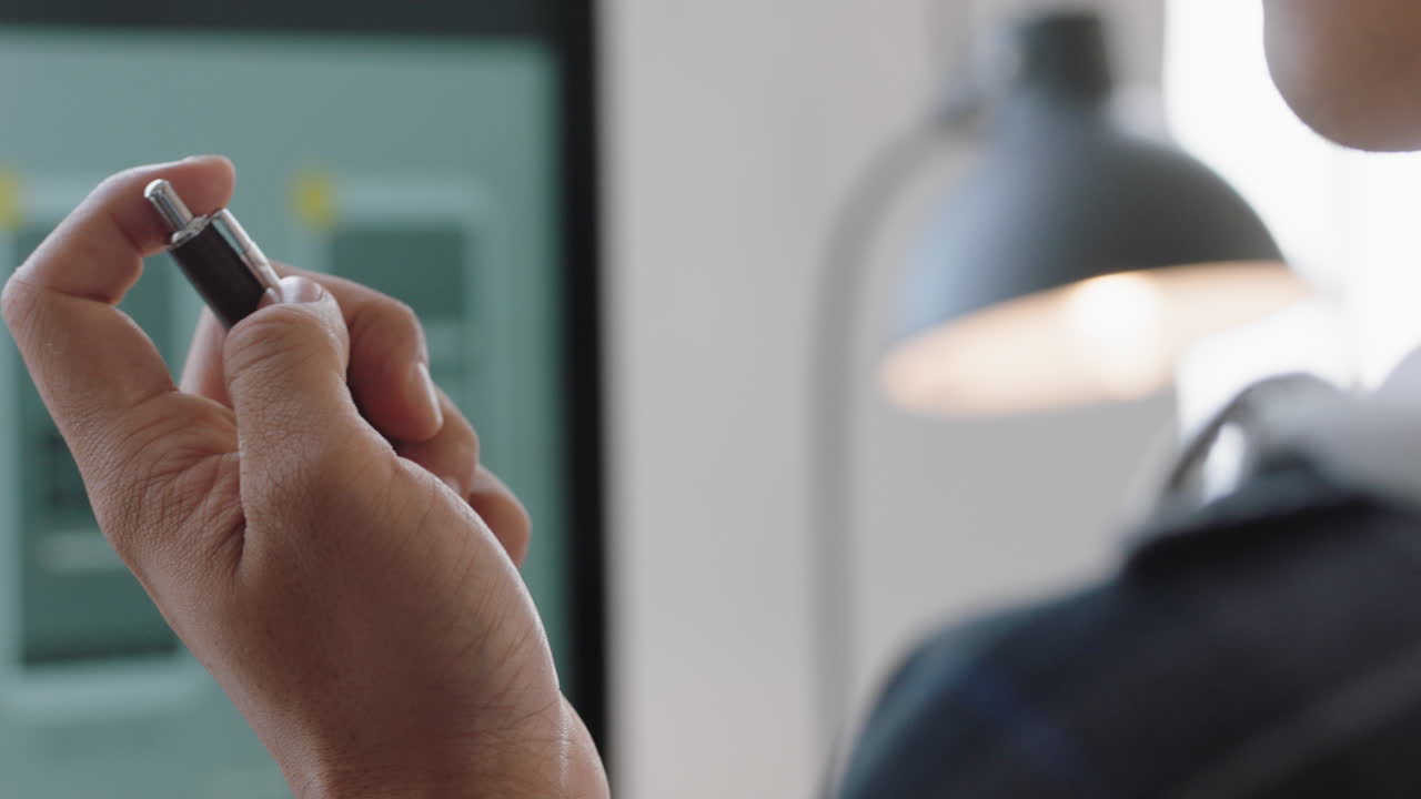 close up businessman holding pen web developer brainstorming ideas for mobile application thinking of design solution looking at screen