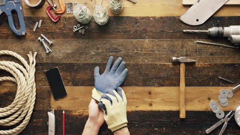 top view artisan craftsman hands putting on gloves from above - red epic dragon