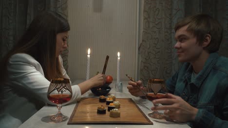 couple enjoying a romantic sushi dinner