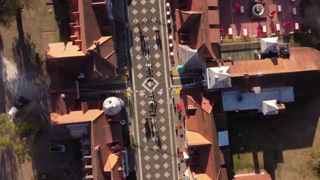 Aerial-top-down-view-of-people-walking-at-fair-festivity-on-the-street-in-4K