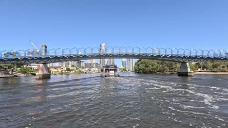 scenic river journey beneath a modern bridge