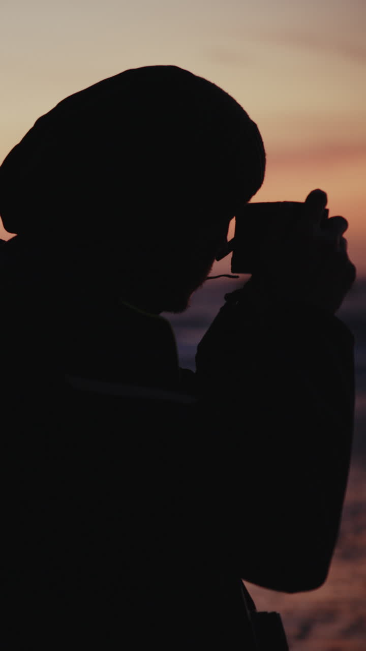 Silhouette of a person on a beach at sunset