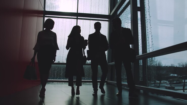 Business Team Walking in Office Corridor