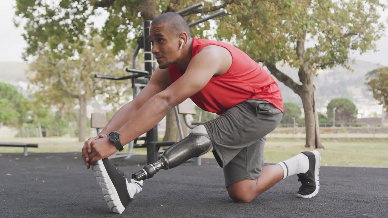 Side view man with prosthetic leg stretching