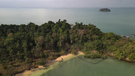 Drone-fly-over-the-ocean-lagoon,-aerial-fly-of-the-drone-flying-over-the-palm-trees-in-a-lagoon