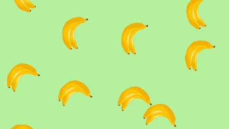 Animation-of-single-bananas-floating-on-green-background