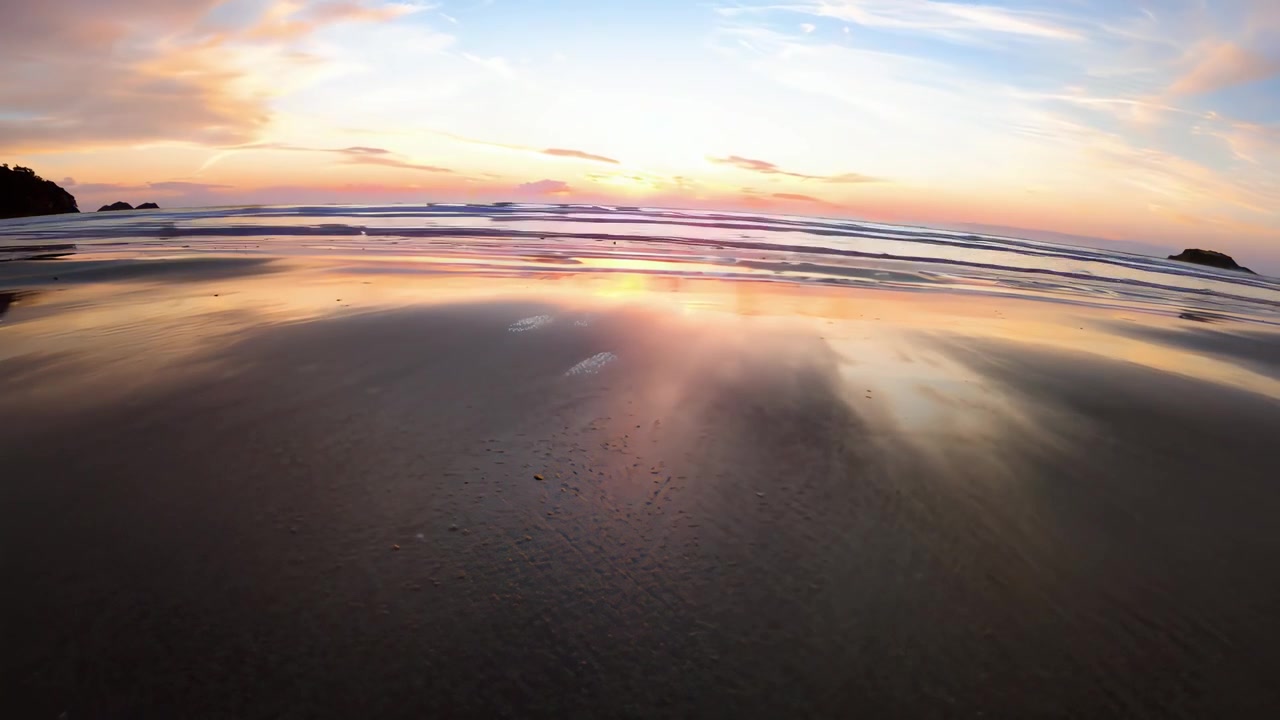 Bioluminescent Plankton Glowing on a Beach at Sunset and Twilight