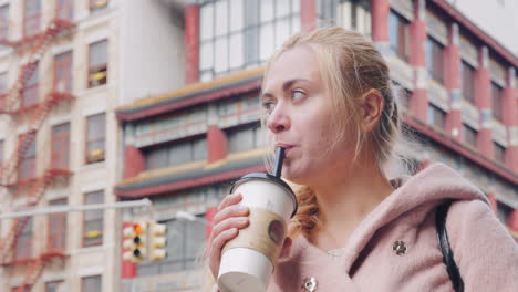 young tourist drink bubble tea in chinatown new york usa 1