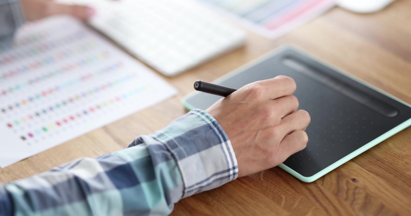 Businessman writes signature on screen of digital tablet