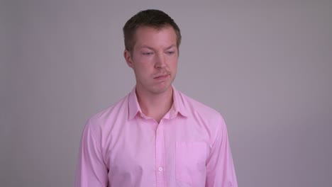 young handsome businessman with pink shirt