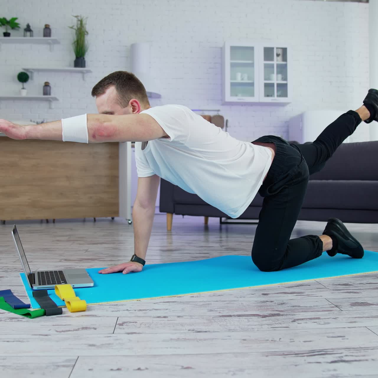 Quarantine time training indoor. Active lifestyle male doing exercises in home