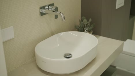 modern bathroom vanity with white sink and faucet