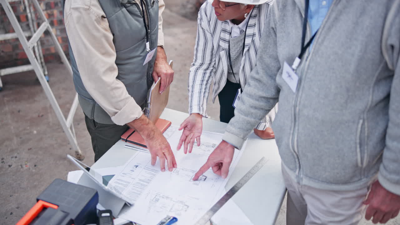 Construction team reviewing blueprints