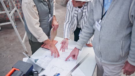construction team reviewing blueprints