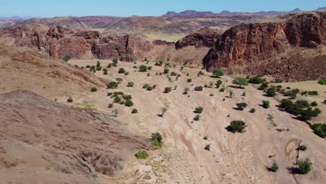 Scenic-aerial-landscape-of-a-dry-riverbed-and-mountain-wilderness-of-northern-Namibia