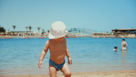 Adorable-children-running-to-sea-in-resort.-Two-boys-playing-at-coastline.