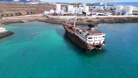 magic aerial view flight old liquified natural gas lng ship
shipwreck on beach sandbank lanzarote canary islands, sunny day spain 2023